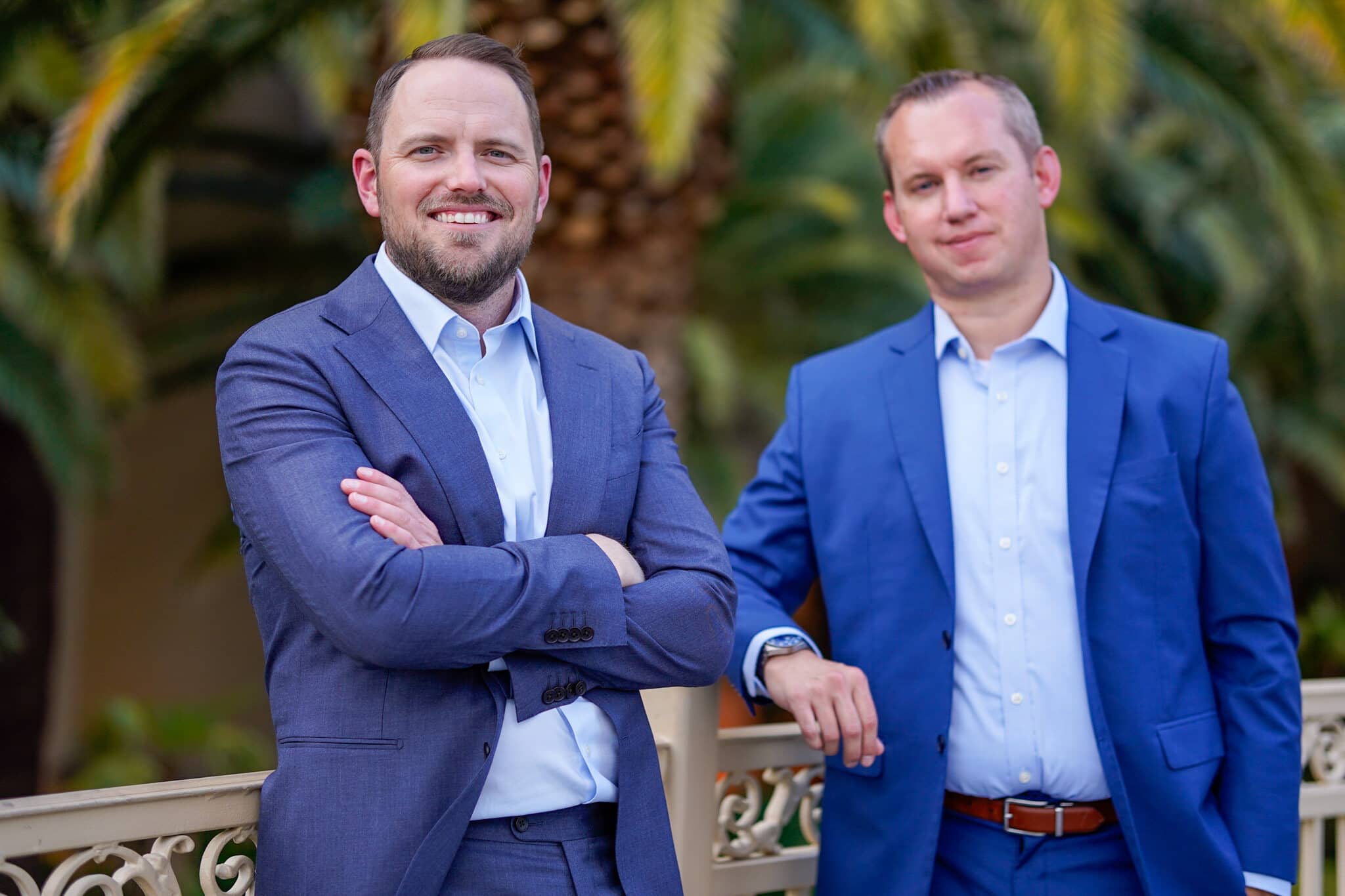 Two attorneys smiling outside