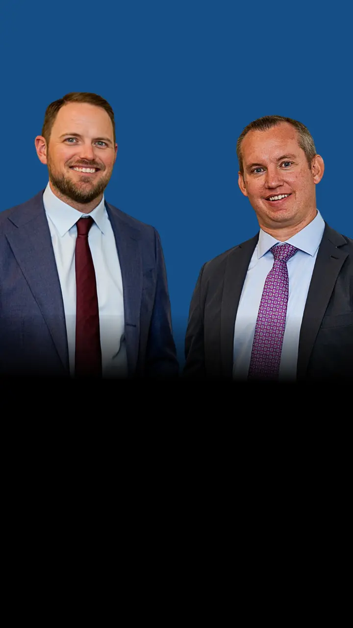 Las Vegas personal injury attorneys Will and Scott standing side by side.